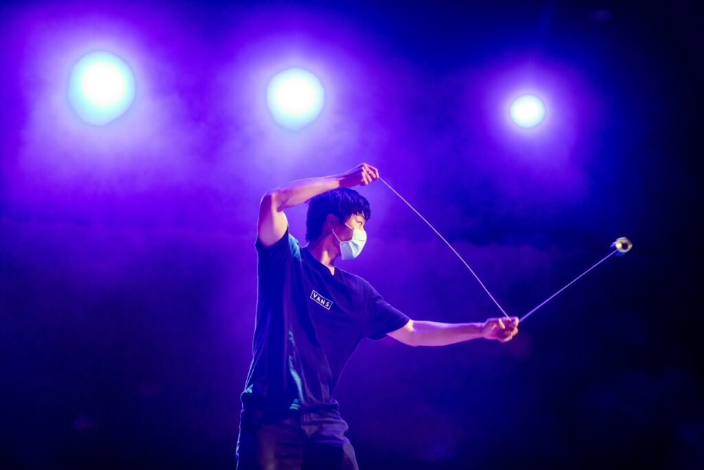 Master yo-yo performer Asher Mai weaves intricate designs and performs stringed aerial aerobatics as the diverse talents of the student community take the stage at Foellinger Auditorium during the third-annual Global Talent Show